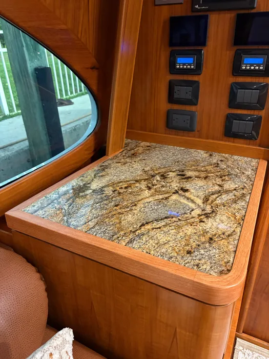 Helm station counter wrapped in a granite finish with woodgrain trim