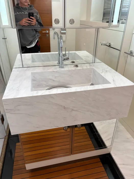 Yacht vanity and sink wrapped in a marble finish