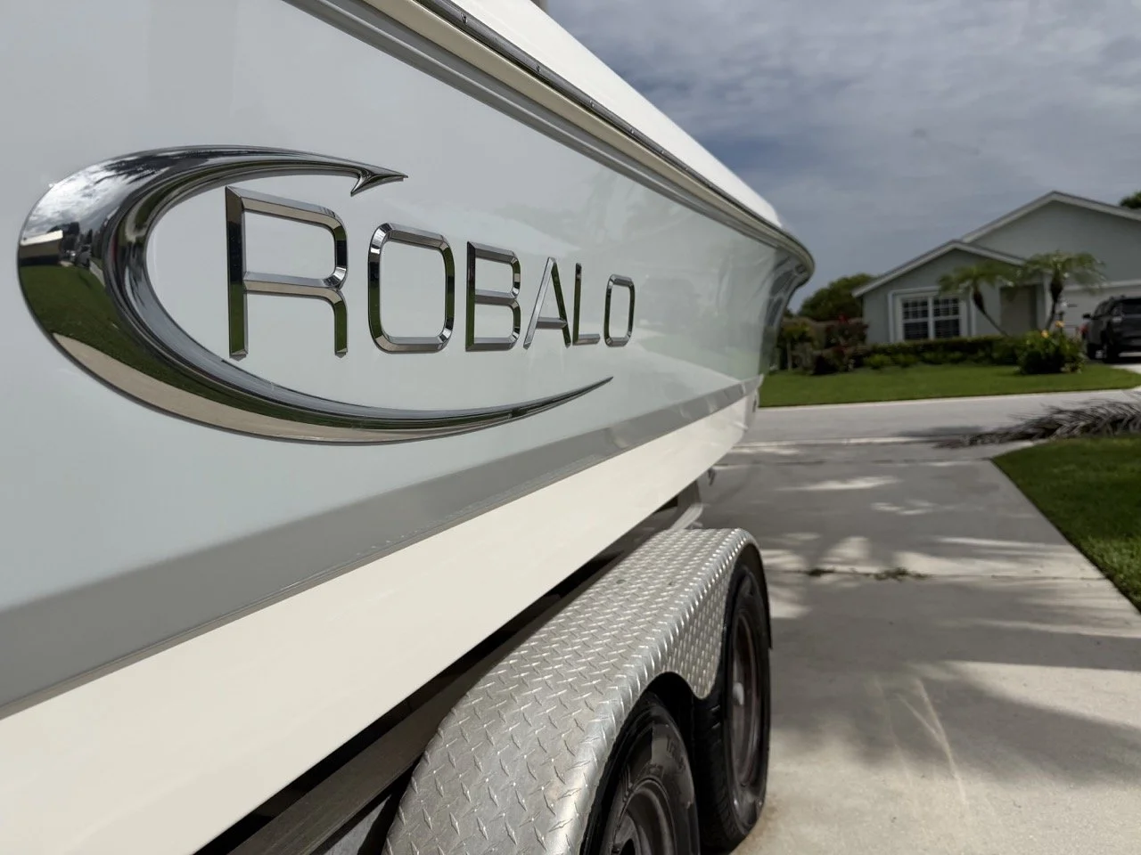 Close-up of polished hull lettering on a Robalo by First Due Marine Co.
